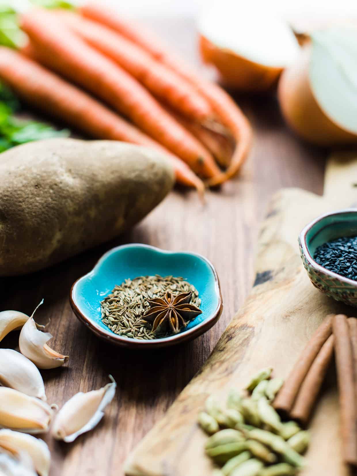 cumin seeds and star anise in a bowl.