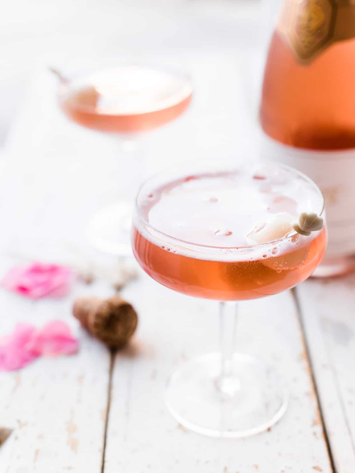Champagne coupe glasses with sparkling rose, lychee and rosewater mimosas.