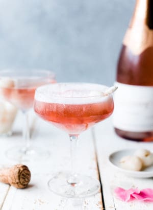 Pink mimosa in champagne coupe with lychee and rosewater.