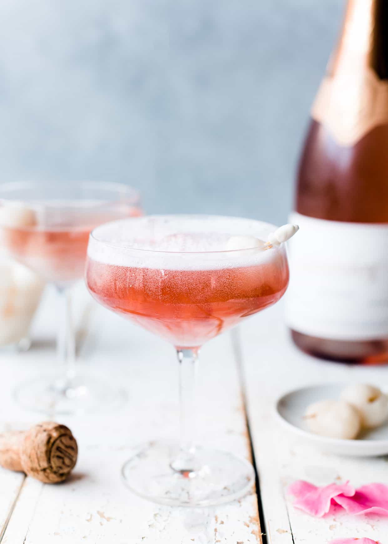 Pink mimosa in champagne coupe with lychee and rosewater.