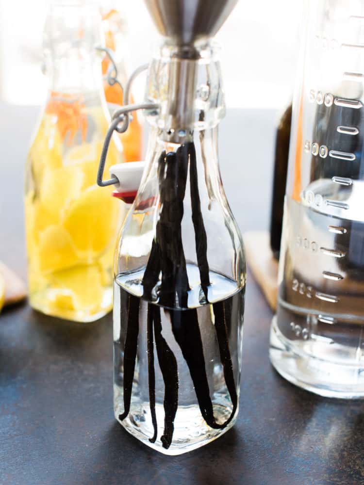 Vanilla bean in vodka for homemade vanilla extract in a bottle.