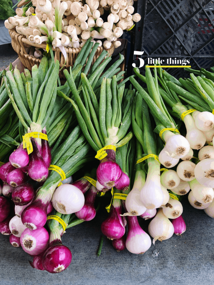 Purple and white spring onions at a Bay Area farmer's market.