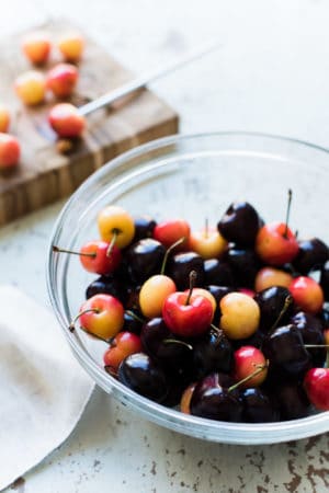 bowl of summer cherries and how to pit cherries tutorial