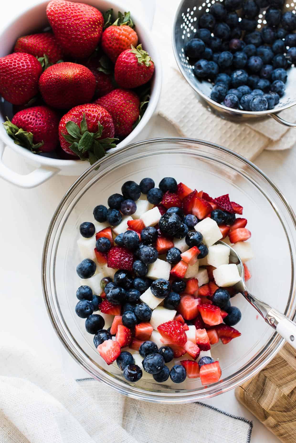 Blueberries, strawberries and jicama in a bowl for Red White and Blue Berry Jicama Salad.