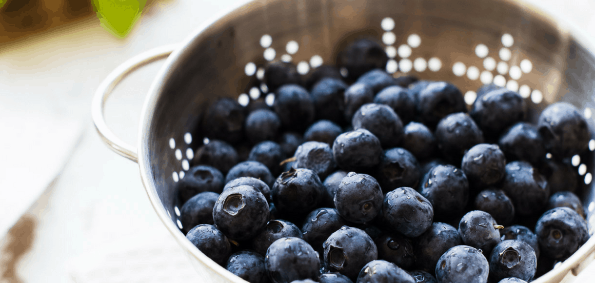 Bowl of blueberries in a colander.
