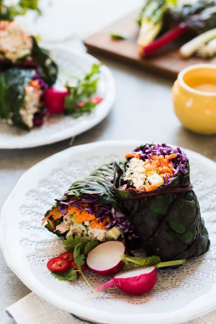Thai-style chicken salad rainbow chard wraps on a white plate.