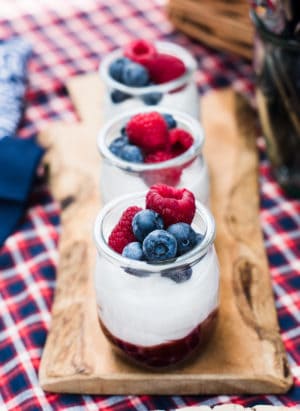 Mixed Berry Fruit-on-the-Bottom Yogurt Cups on a cutting board.