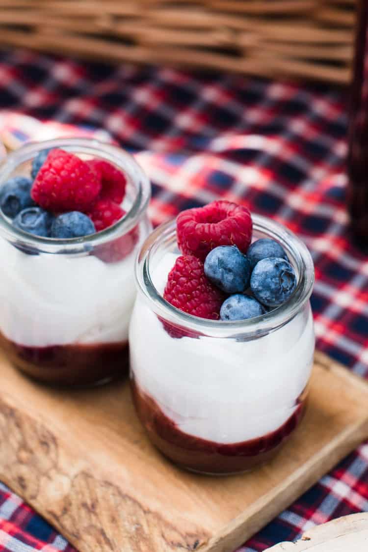 Mixed Berry Fruit-on-the-Bottom Yogurt Cups in glass jars with fresh fruit.