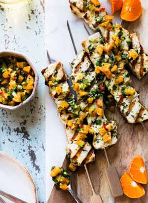 Grilled Swordfish Kebabs with Citrus Herb Salsa on a cutting board with salsa on the side.