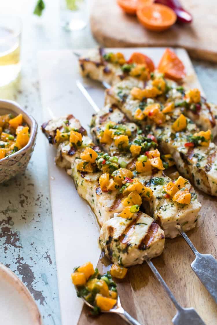 Grilled Swordfish Kebabs with Citrus Herb Salsa on a serving board.