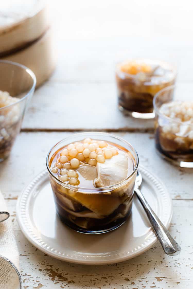 Homemade taho in a glass on a cream dish.