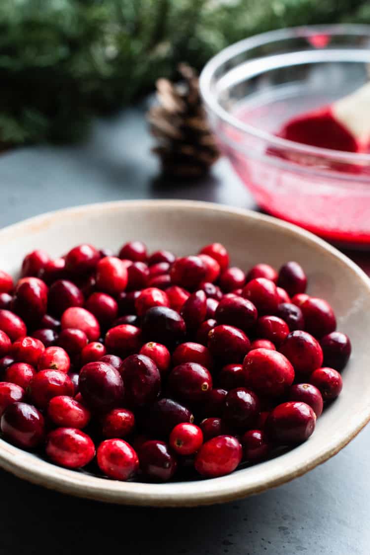 A bowl of cranberries for making cranberry curd.