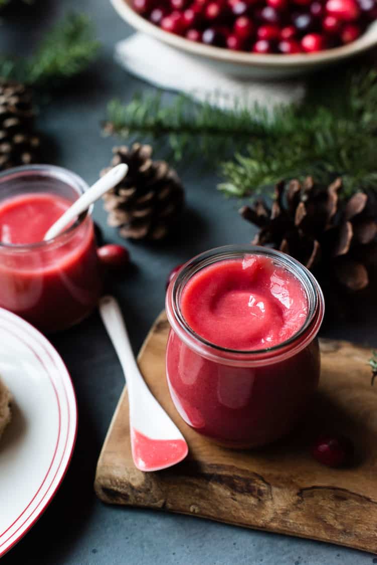 Jars of cranberry curd made with fresh cranberries for the Christmas holidays.