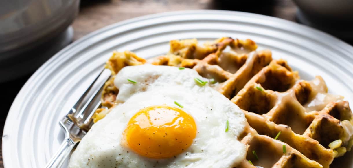 Mashed Potato and Stuffing Waffles served with a sunny side up egg and gravy.