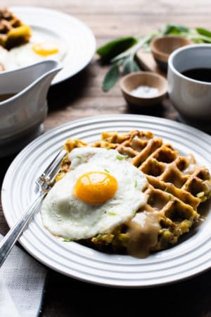 Mashed Potato and Stuffing Waffles served with a sunny side up egg and gravy.