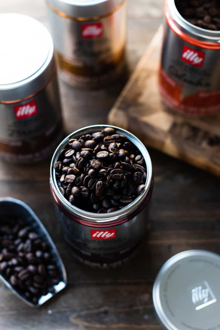 Open can of illy Arabica Selection coffee with coffee beans.