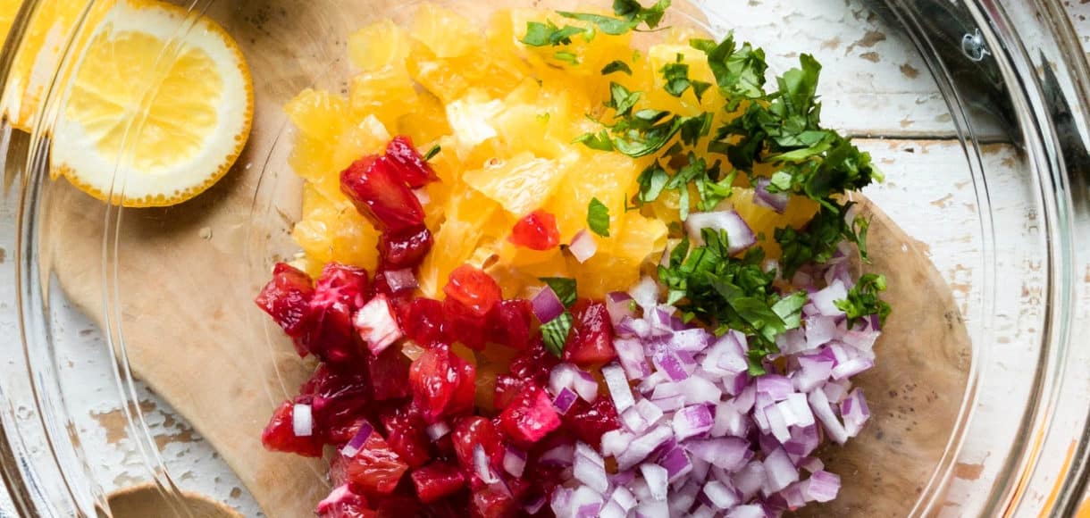 Ingredients for citrus salsa in a bowl.