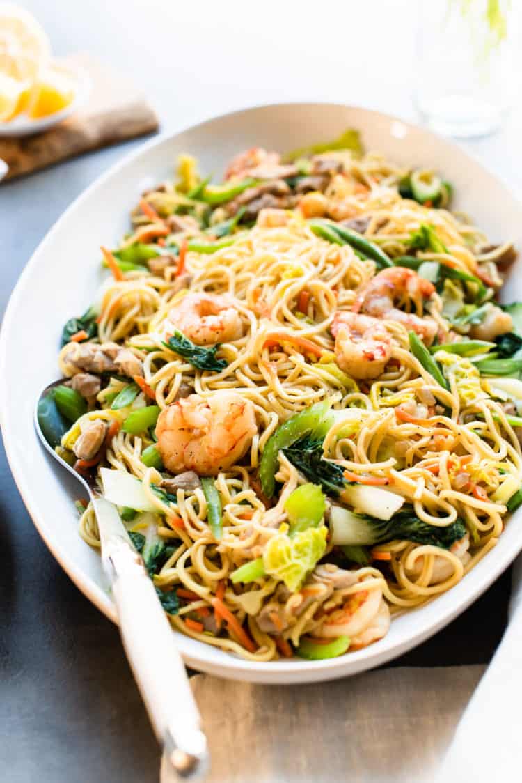 Pancit Canton in a serving dish with spoon.