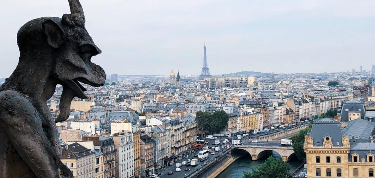 View from gargoyles of Notre Dame Cathedral in Paris for a Paris Travel Guide.