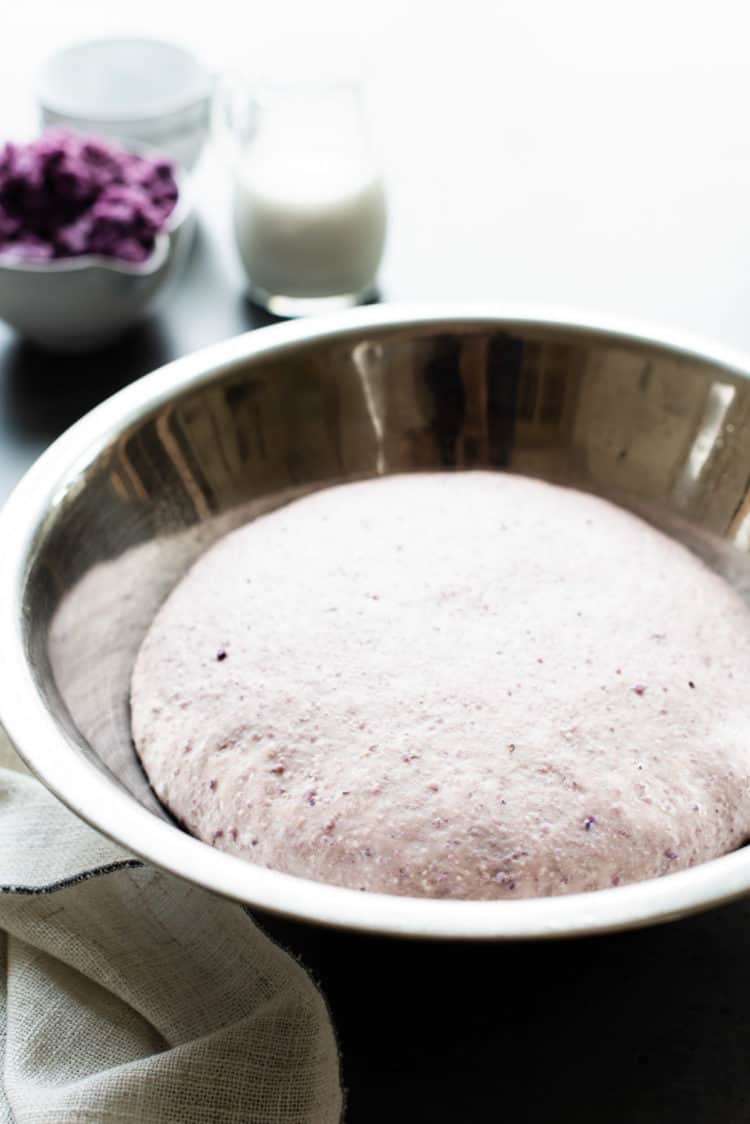 Vegan dough for coconut ube rolls in a bowl.