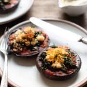Stuffed Portobello Mushrooms with Garlicky Kale on a plate.