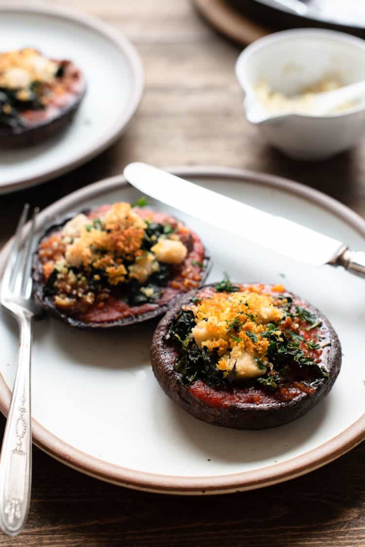 Stuffed Portobello Mushrooms with Garlicky Kale on a plate.