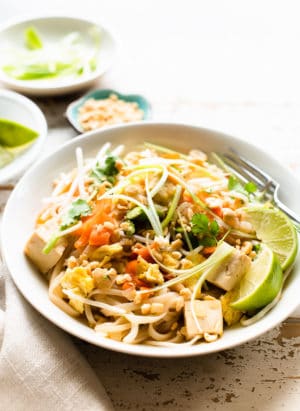 Instant Pot Vegetarian Pad Thai in a serving dish garnished with scallions and cilantro.