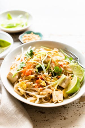 Instant Pot Vegetarian Pad Thai in a serving dish garnished with scallions and cilantro.