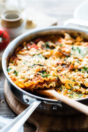 Eggplant skillet lasagna in a stainless steel deep-sided pan.