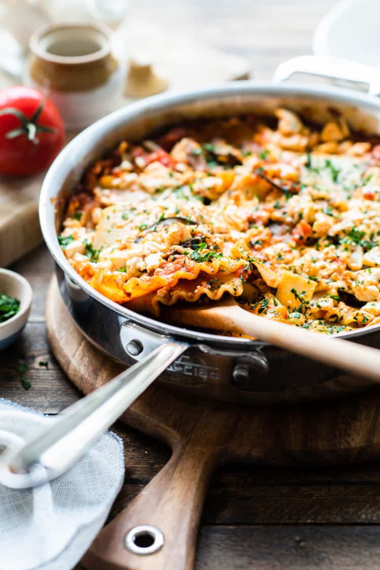 Eggplant skillet lasagna in a stainless steel deep-sided pan.