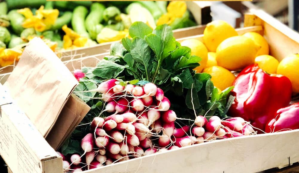 Wheelbarrow of fresh market vegetables in Nice, France, part of Nice Travel Guide.