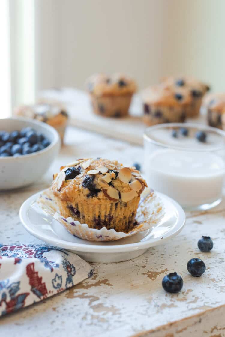Blueberry Almond Butter Muffins on a white plate.