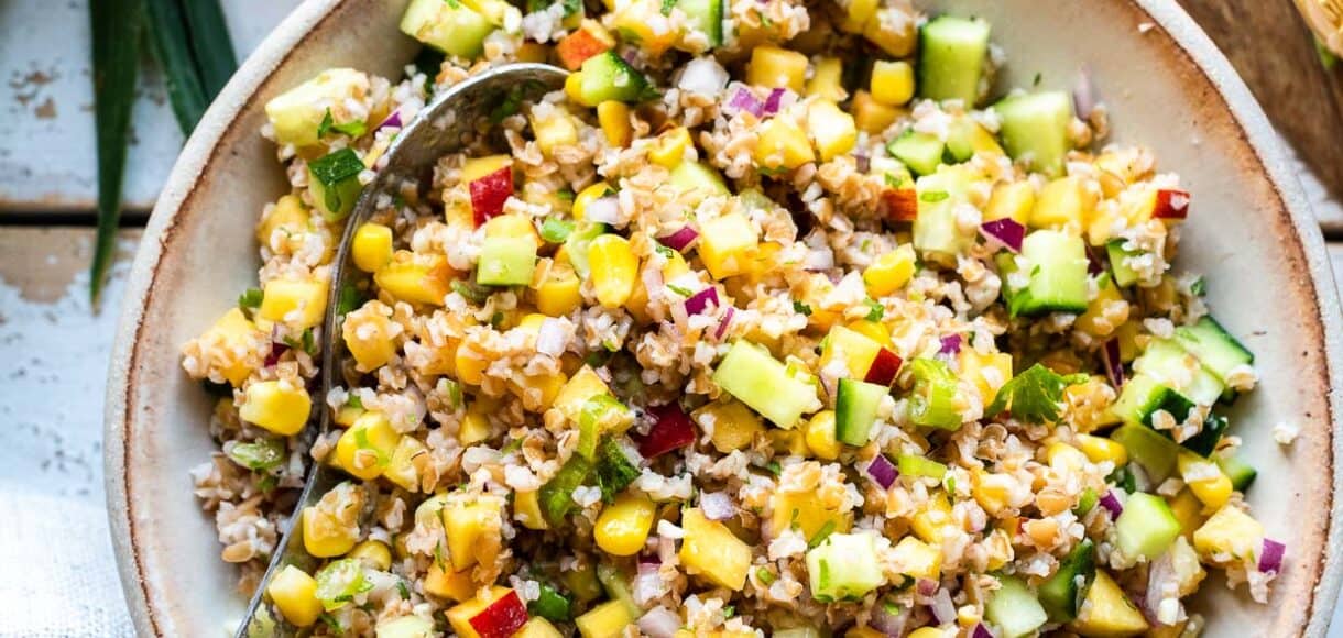 Summer Corn and Nectarine Tabbouleh in a cream colored serving dish.