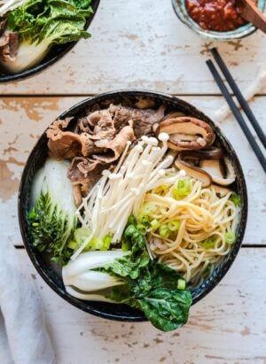 Beef noodle soup in a bowl: mushroom and short rib noodle soup with bok choy.