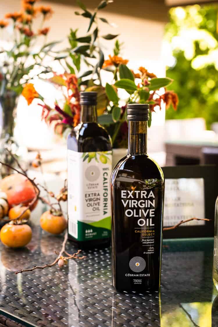 Bottle of Cobram Estate Olive Oil on a table.