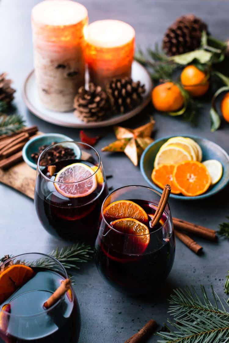 Glasses of mulled wine with citrus and spices for Christmas.