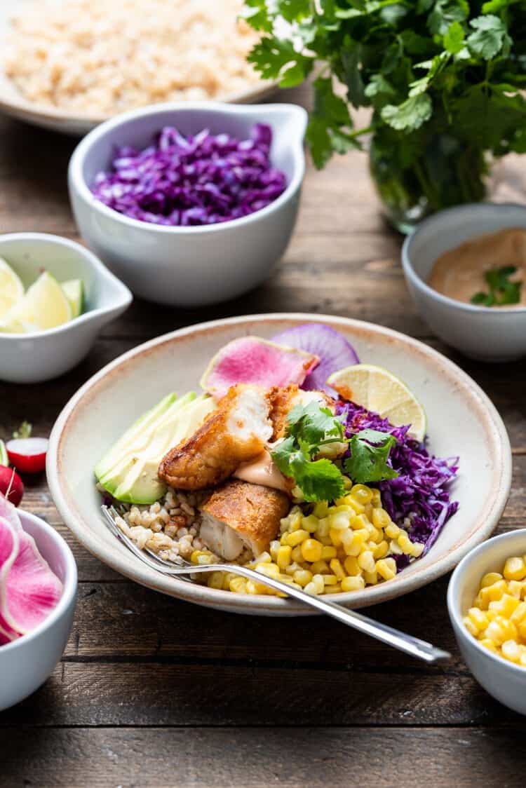 Alaska pollock fish tenders in a spicy fish taco bowl with cabbage slaw.