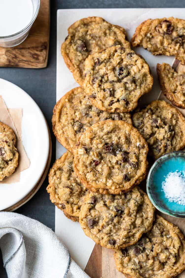 Chocolate Chip Cranberry Oat Cookies on a marble board with sea salt.