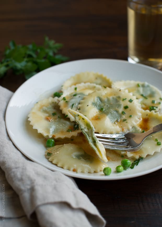 Laminated Parsley Ravioli Stuffed with Parsley, Chive and Chèvre on a white plate.