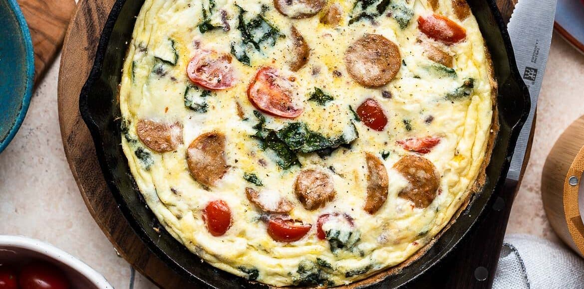Italian Sausage and Kale Frittata in a cast iron skillet.