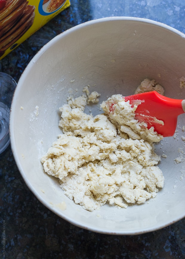 Mixing biscuit dough together.
