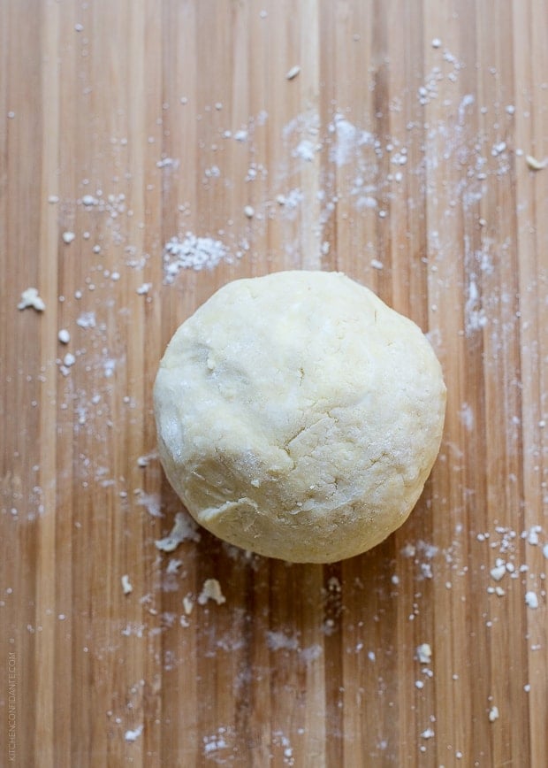 Biscuit dough on a floured surface.