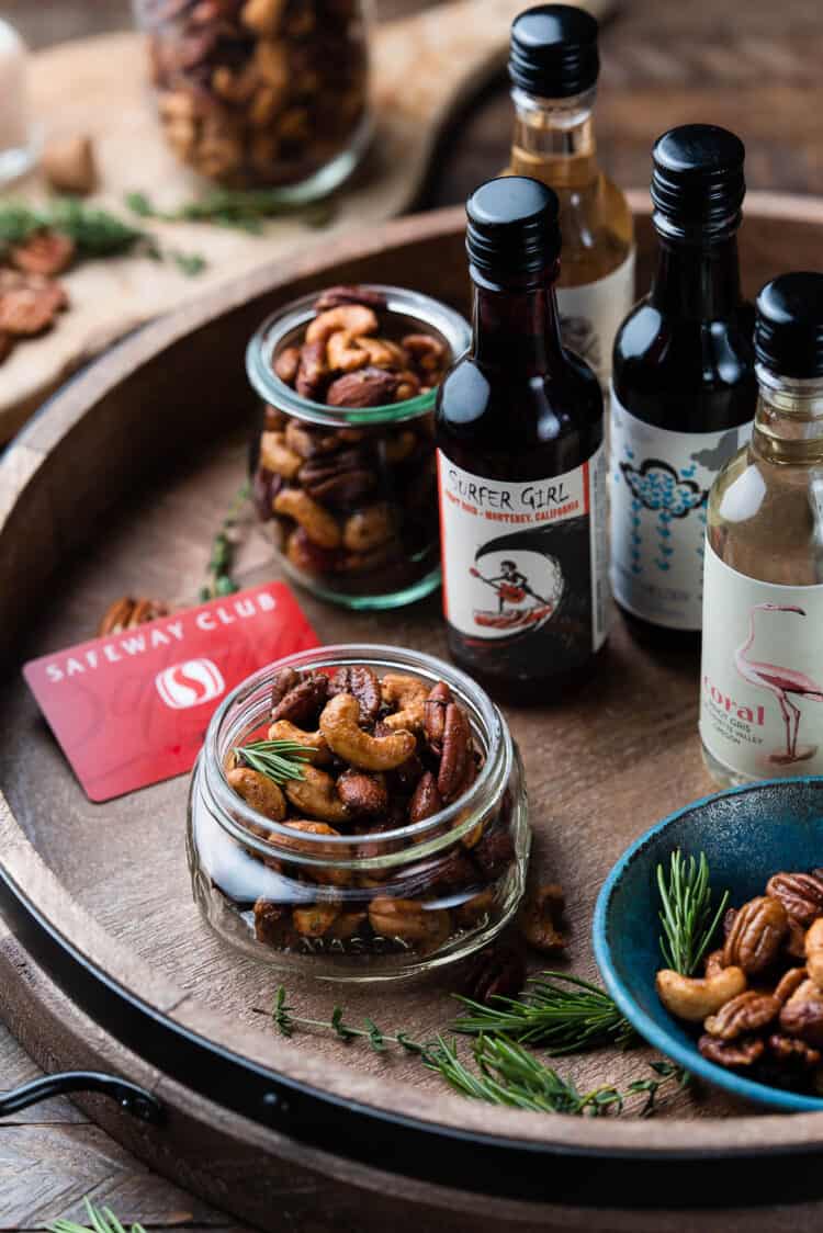 Homemade spiced nuts on a tray with wines from the Wine Advent Calendar