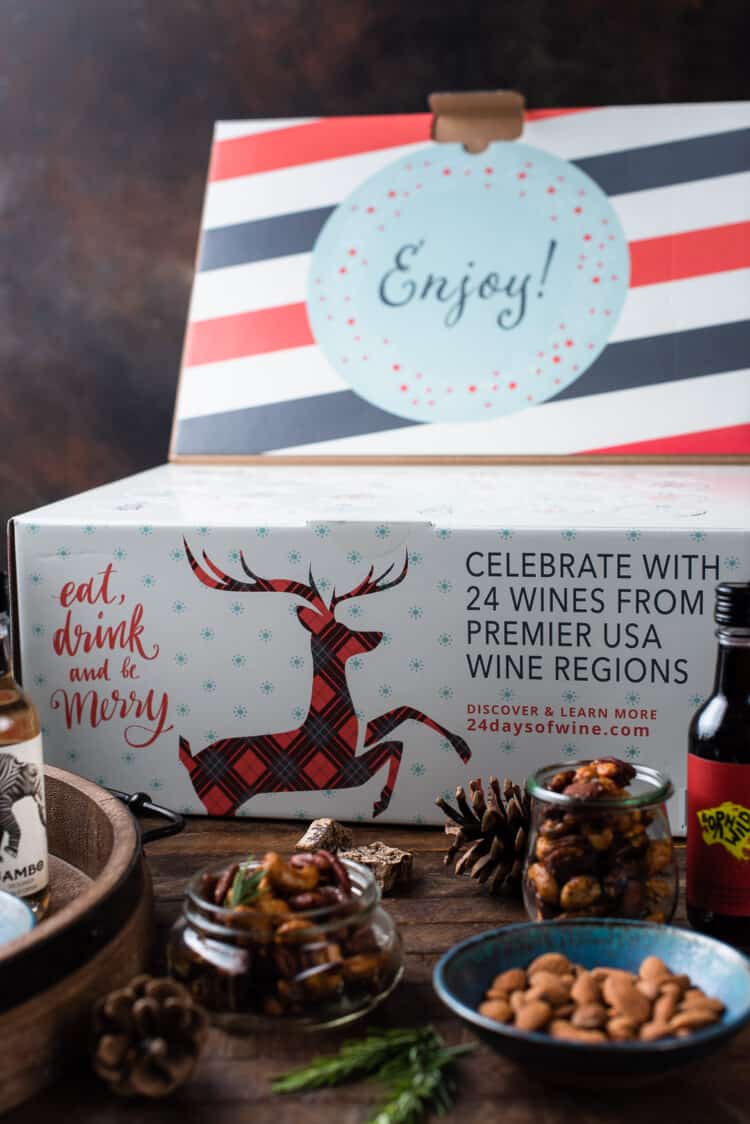 Wine Advent Calendar on a wooden table with holiday spiced nuts.