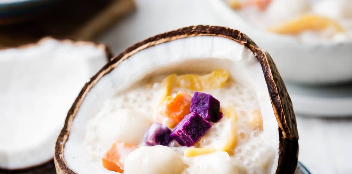 Ginataang Bilo Bilo in a coconut shell is one of 10 Easy Filipino Desserts with Coconut Milk