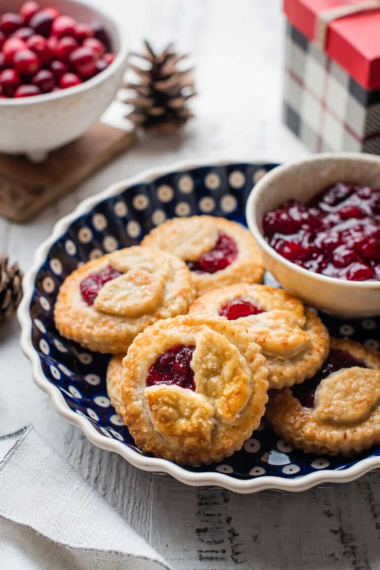 Cranberry Hand Pies in a blue pie dish.