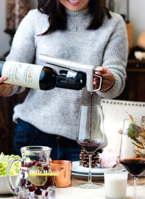 Pouring a glass of wine is one of Five Little Things I loved the week of November 21, 2020, including Thanksgiving traditions, gingerbread houses with a twist, good humans, and more.