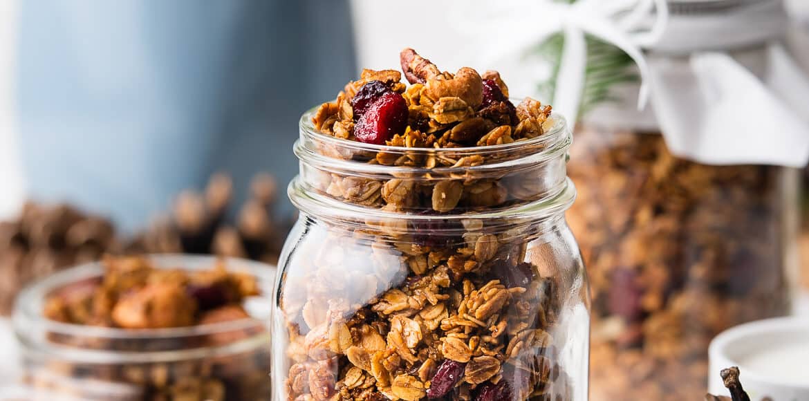 Gingerbread Granola in a glass mason jar.