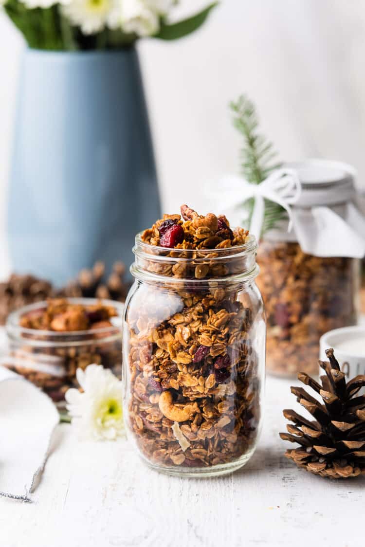 Gingerbread Granola in a glass mason jar.