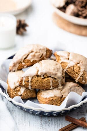 Gingerbread Scones stacked on a blue baking dish